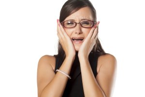 young woman needs to relieve a toothache