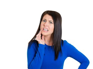 woman with sensitive tooth